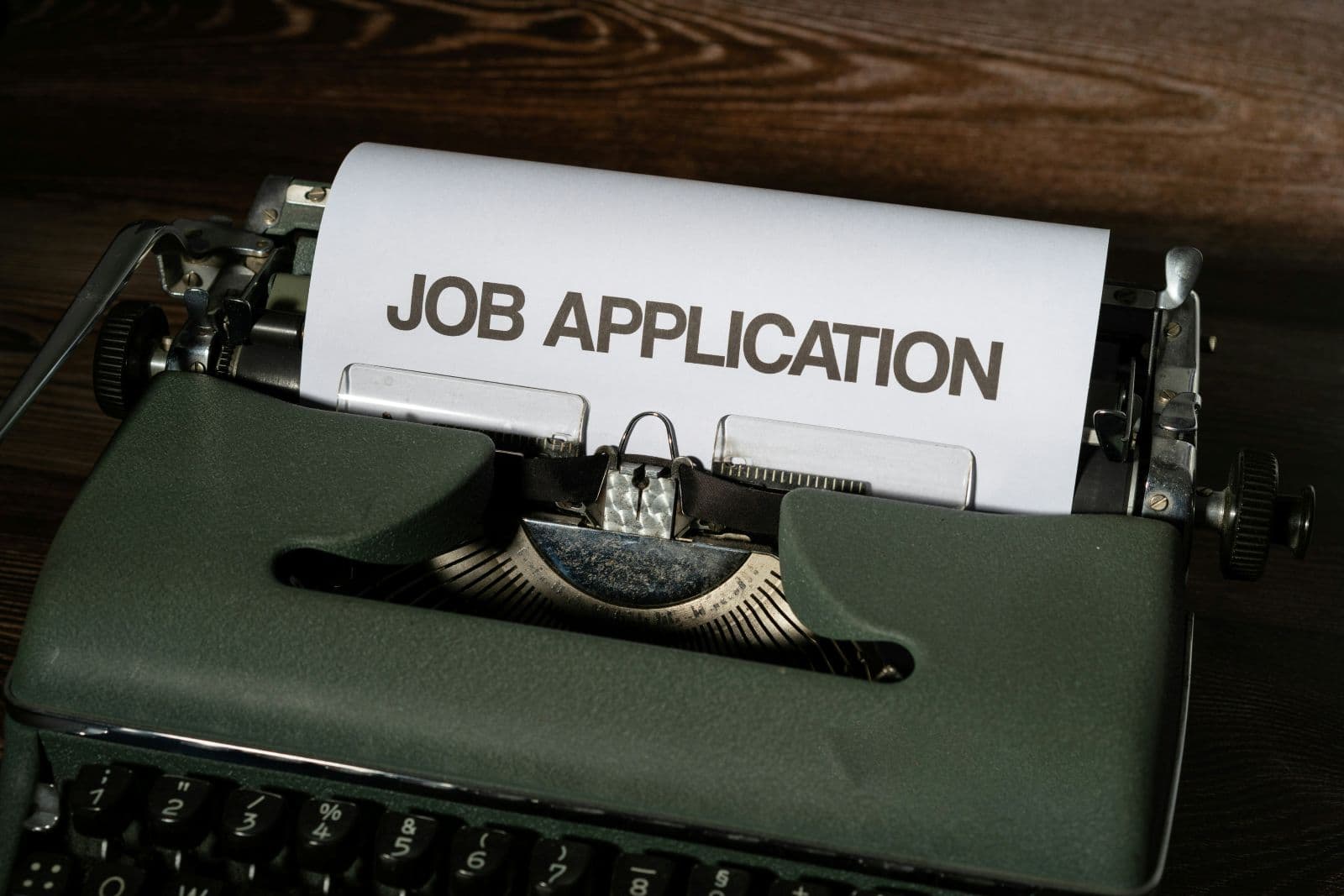 Clean resume layout on a desk with pen and glasses